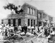 Workers at the construction of the BC POH; taken after the laying of the cornerstone ceremony, 1892