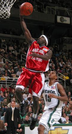 Magic Johnson All-Stars' Preston Murphy, Left, Puts in a...